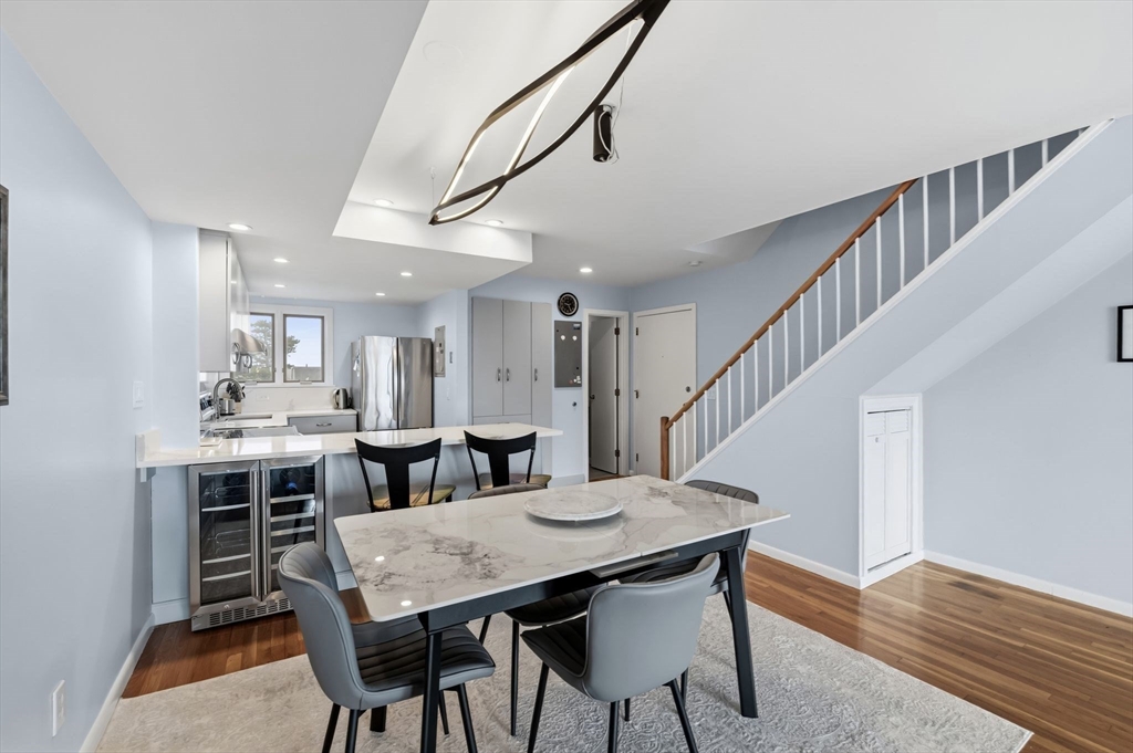 60 Brackett Place, Unit D Marblehead, MA 01945 - Photo 12 of 30 a view of a dining room with furniture and wooden floor