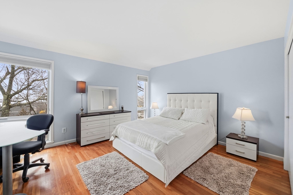 60 Brackett Place, Unit D Marblehead, MA 01945 - Photo 20 of 30 a bedroom with a bed and window