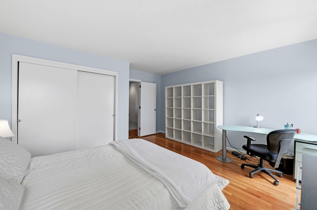 60 Brackett Place, Unit D Marblehead, MA 01945 - Photo 21 of 30 a bedroom with a bed and a desk