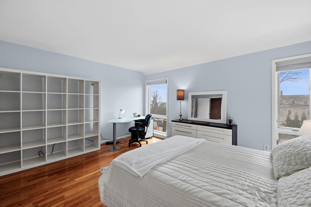 60 Brackett Place, Unit D Marblehead, MA 01945 - Photo 22 of 30 a bedroom with a bed and a flat screen tv