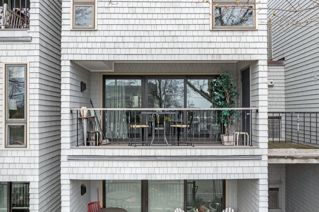 60 Brackett Place, Unit D Marblehead, MA 01945 - Photo 4 of 30 a view of a house with a balcony