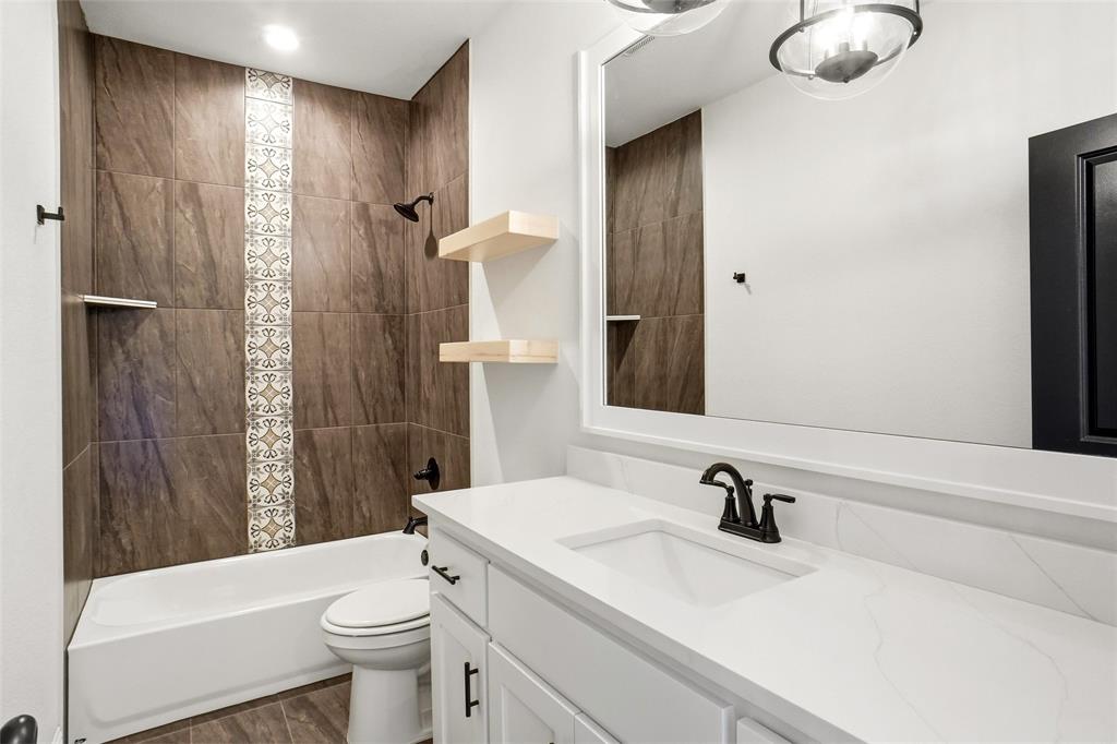 218 Legacy Boulevard Weatherford, TX 76086 - Photo 15 of 20 a bathroom with a sink toilet and shower