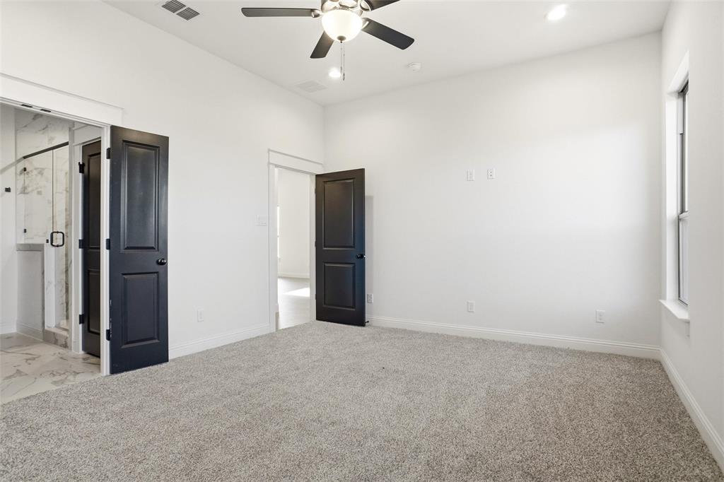 218 Legacy Boulevard Weatherford, TX 76086 - Photo 10 of 20 an empty room with fan and entrance