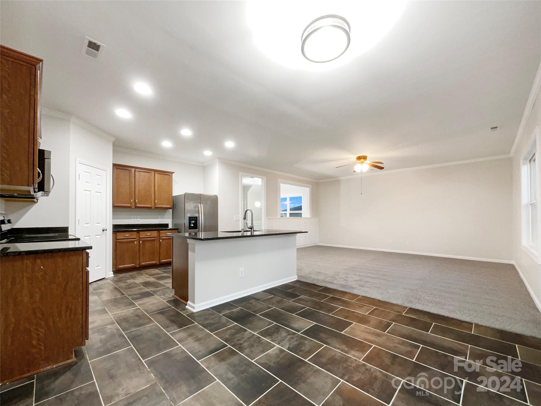 1005 Garden Web Road Indian Trail, NC 28079 - Photo 15 of 25 a view of kitchen with sink microwave and cabinets