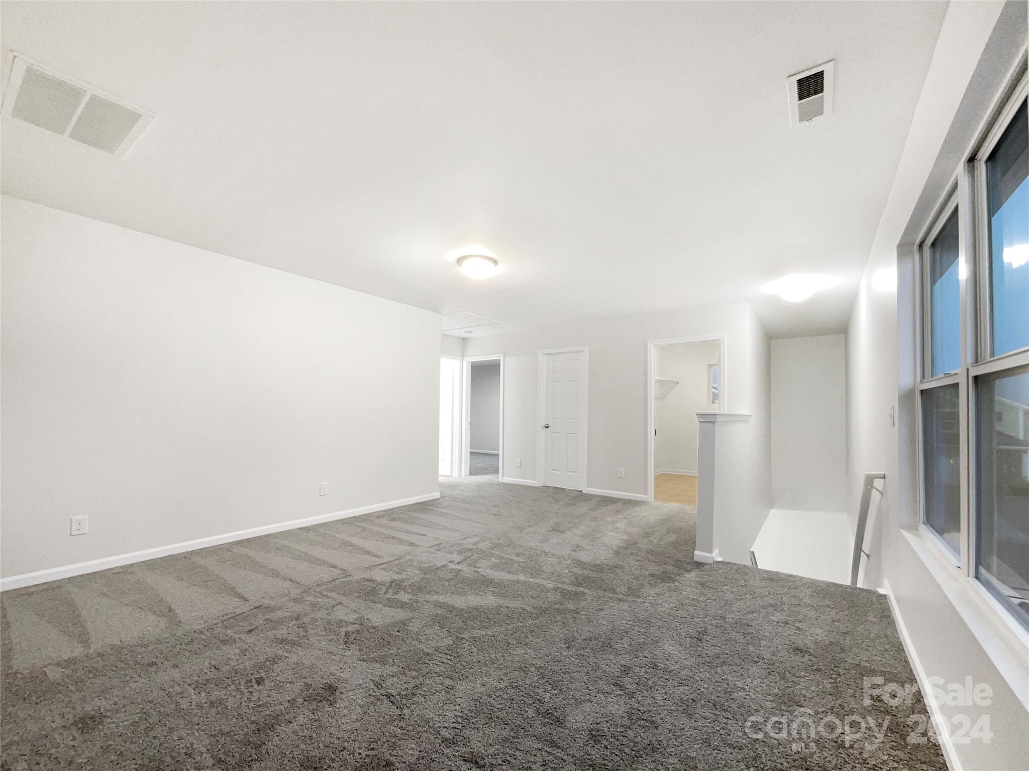 1005 Garden Web Road Indian Trail, NC 28079 - Photo 16 of 25 a view of a big room with a fireplace