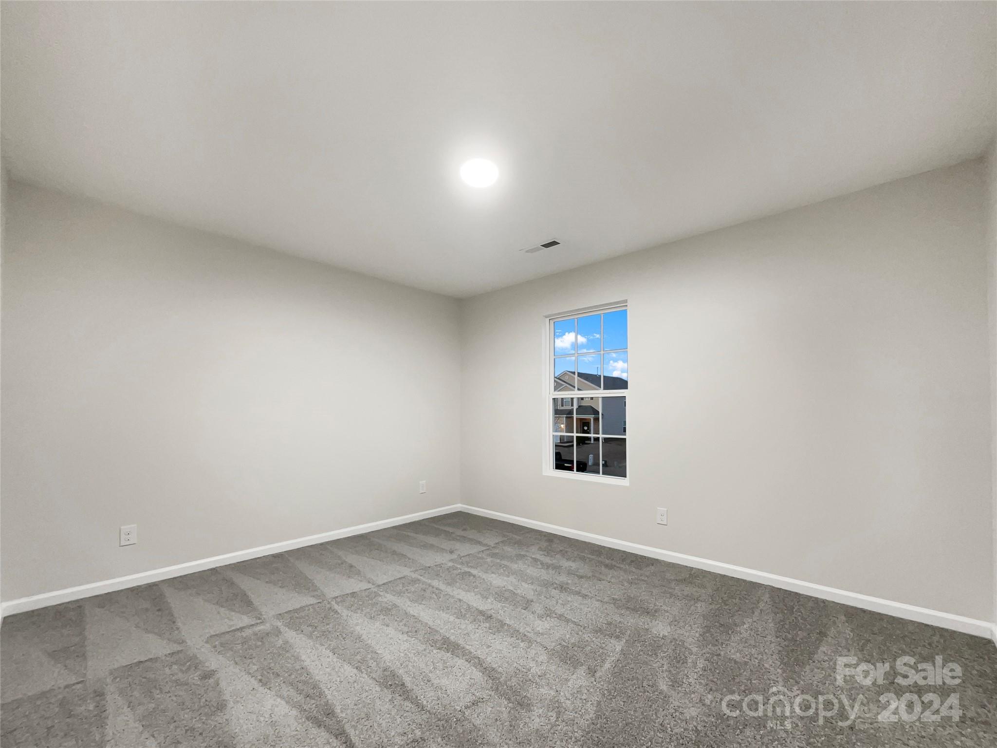 1005 Garden Web Road Indian Trail, NC 28079 - Photo 17 of 25 an empty room with a window