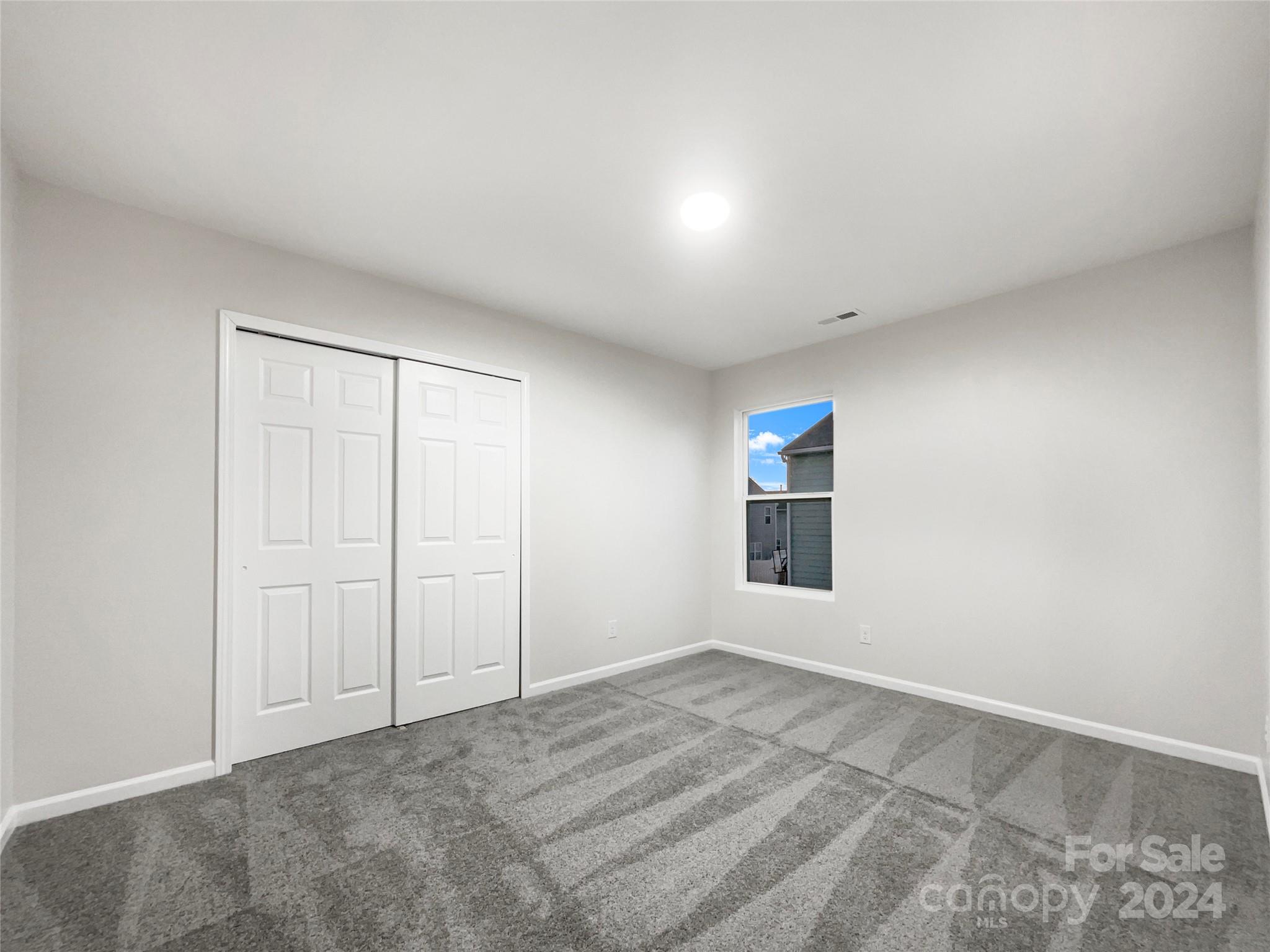 1005 Garden Web Road Indian Trail, NC 28079 - Photo 18 of 25 an empty room with windows