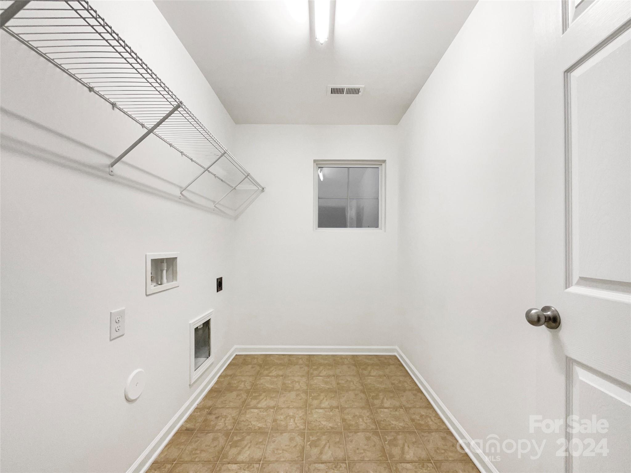 1005 Garden Web Road Indian Trail, NC 28079 - Photo 20 of 25 a view of a livingroom with wooden floor and white walls