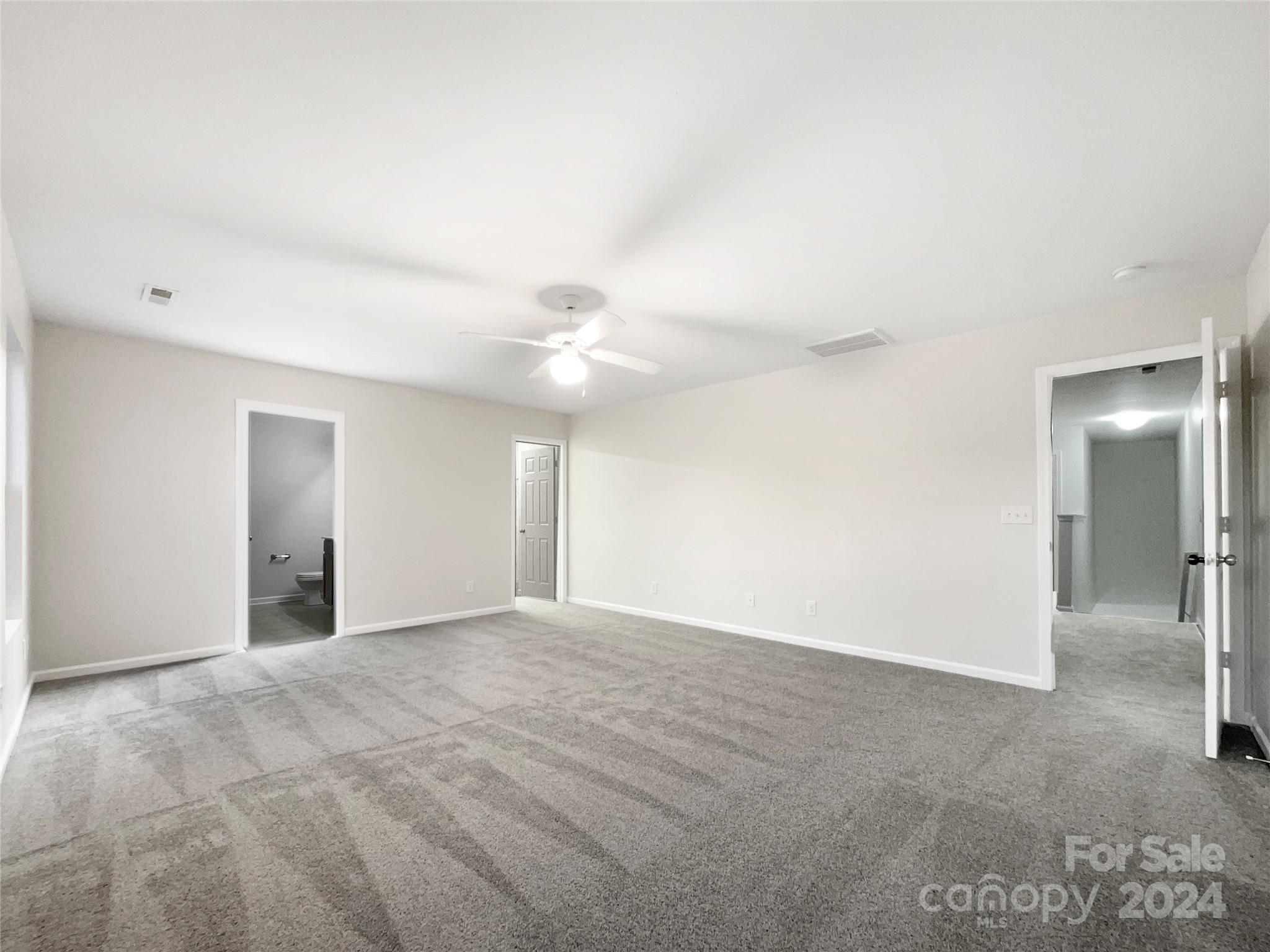 1005 Garden Web Road Indian Trail, NC 28079 - Photo 21 of 25 an empty room with fan and entrance