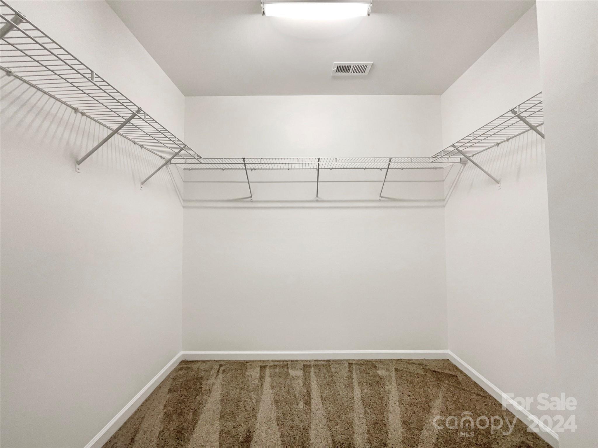 1005 Garden Web Road Indian Trail, NC 28079 - Photo 24 of 25 a view of a room with racks on the wall