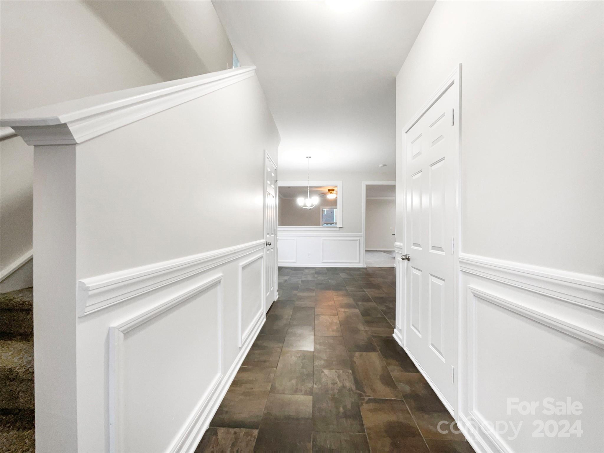 1005 Garden Web Road Indian Trail, NC 28079 - Photo 8 of 25 a view of a hallway with wooden floor
