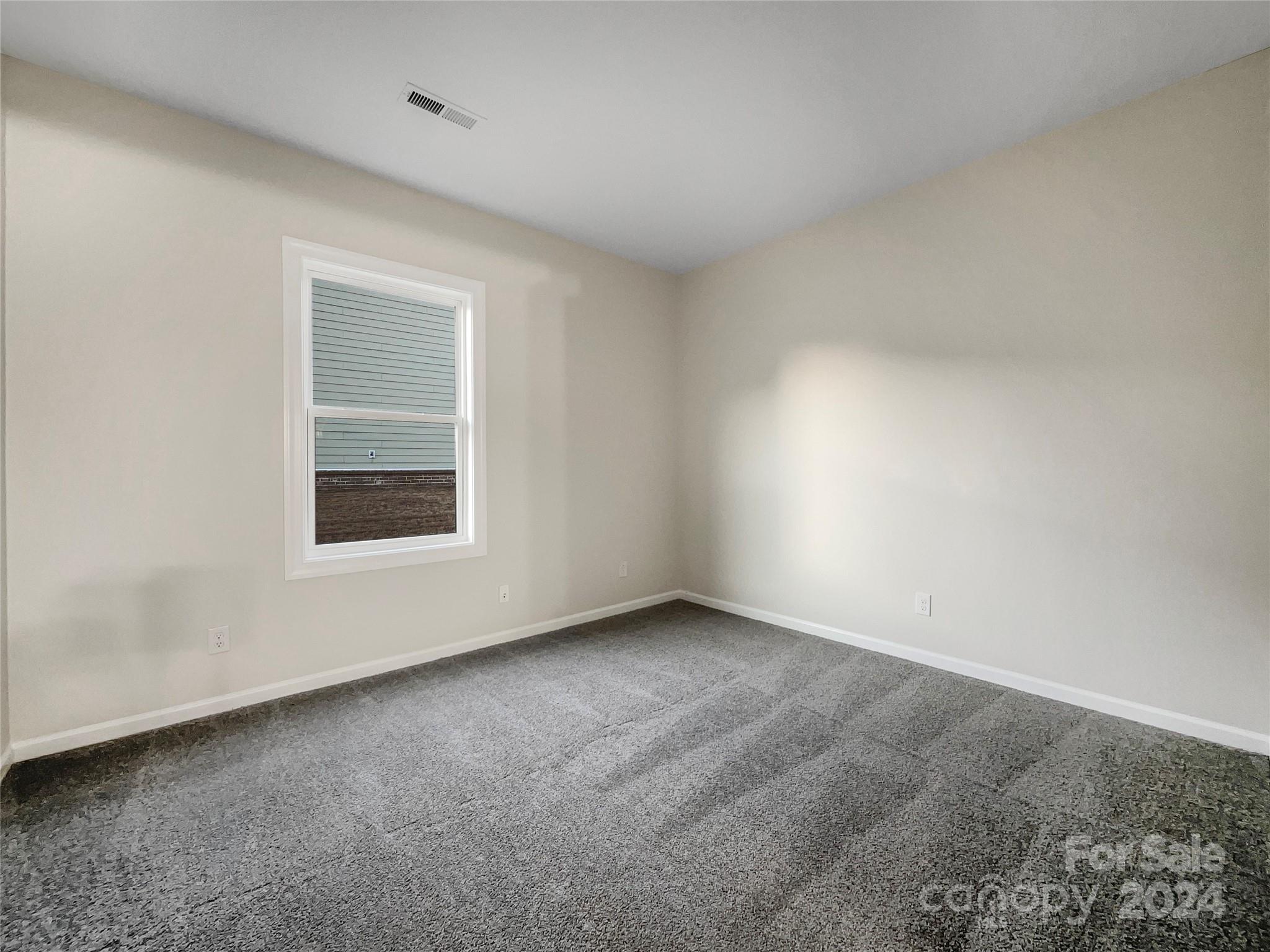 1005 Garden Web Road Indian Trail, NC 28079 - Photo 9 of 25 a view of an empty room with a window