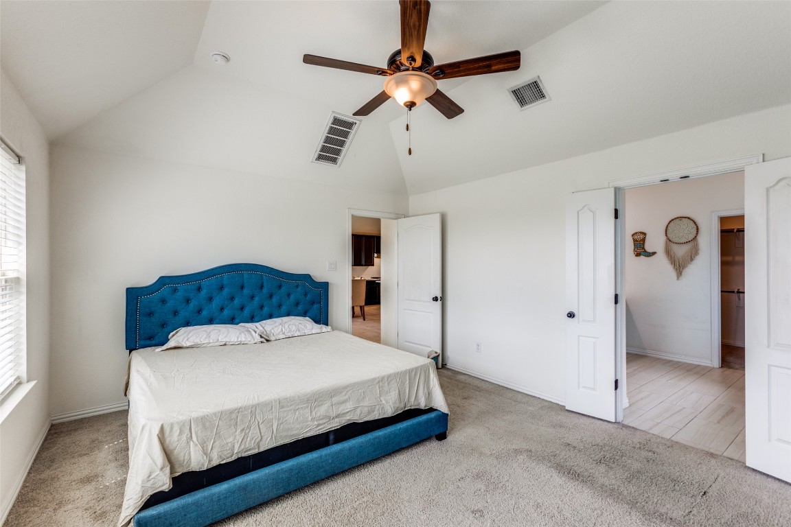 874 Spinnaker Loop Kyle, TX 78640 - Photo 13 of 30 Bedroom with lofted ceiling, carpet floors, and ceiling fan