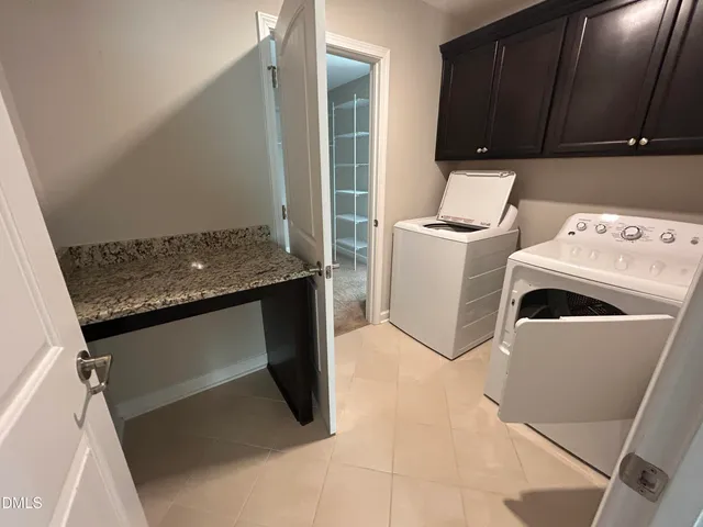 a bathroom with a granite countertop sink a toilet a mirror and shower