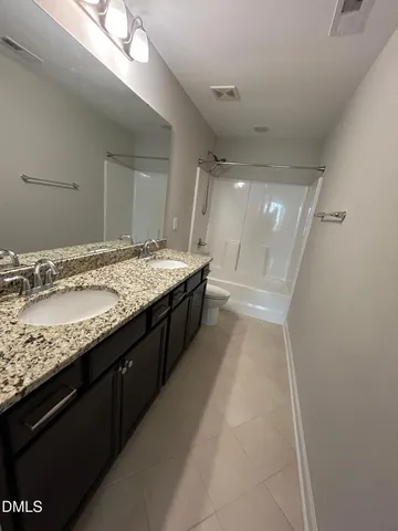 a bathroom with a toilet and a bathtub