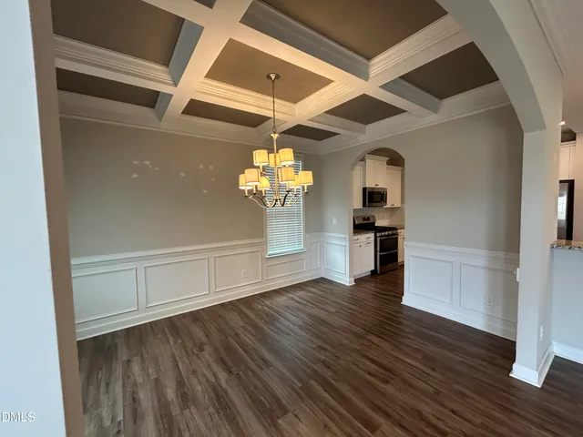 a view of a livingroom with wooden floor