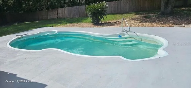 a balcony view with a backyard