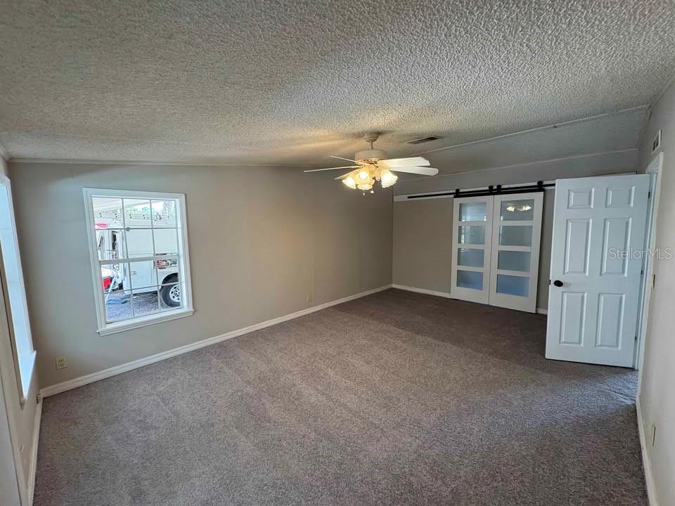 17200 Southeast 97th Terrace Summerfield, FL 34491 - Photo 10 of 14 a view of an empty room with a window