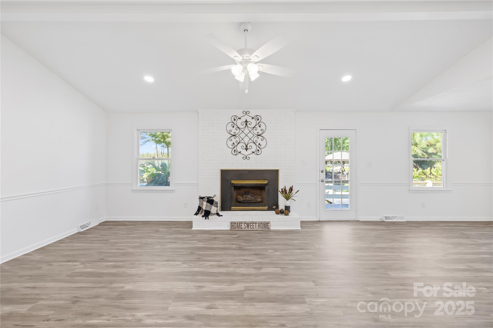 700 Chestnut Lane Matthews, NC 28104 - Photo 12 of 39 a view of an empty room with a window and fireplace