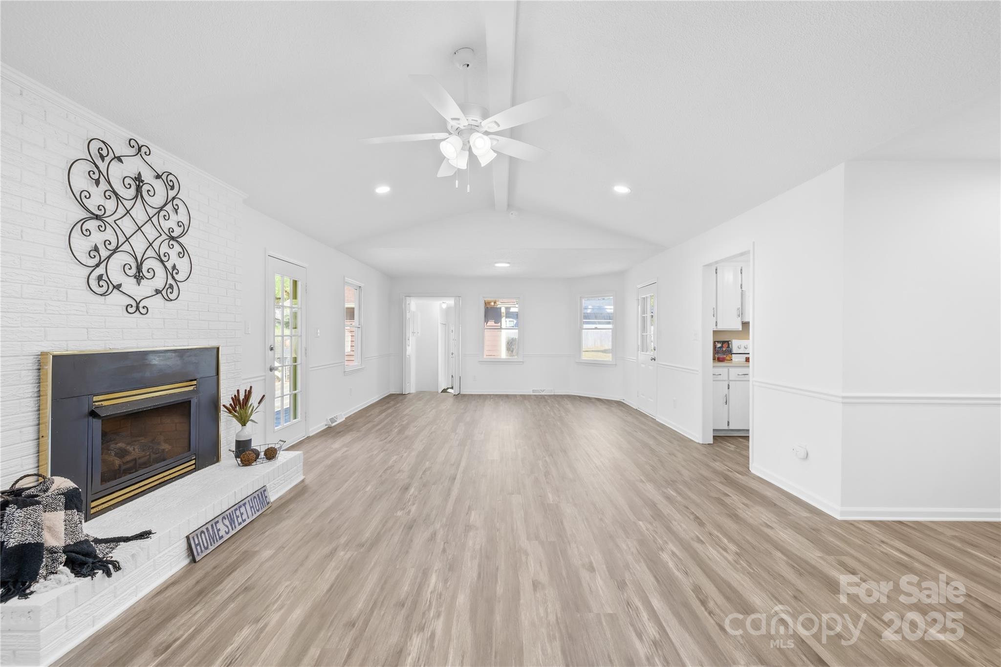 700 Chestnut Lane Matthews, NC 28104 - Photo 14 of 39 an empty room with windows and fireplace