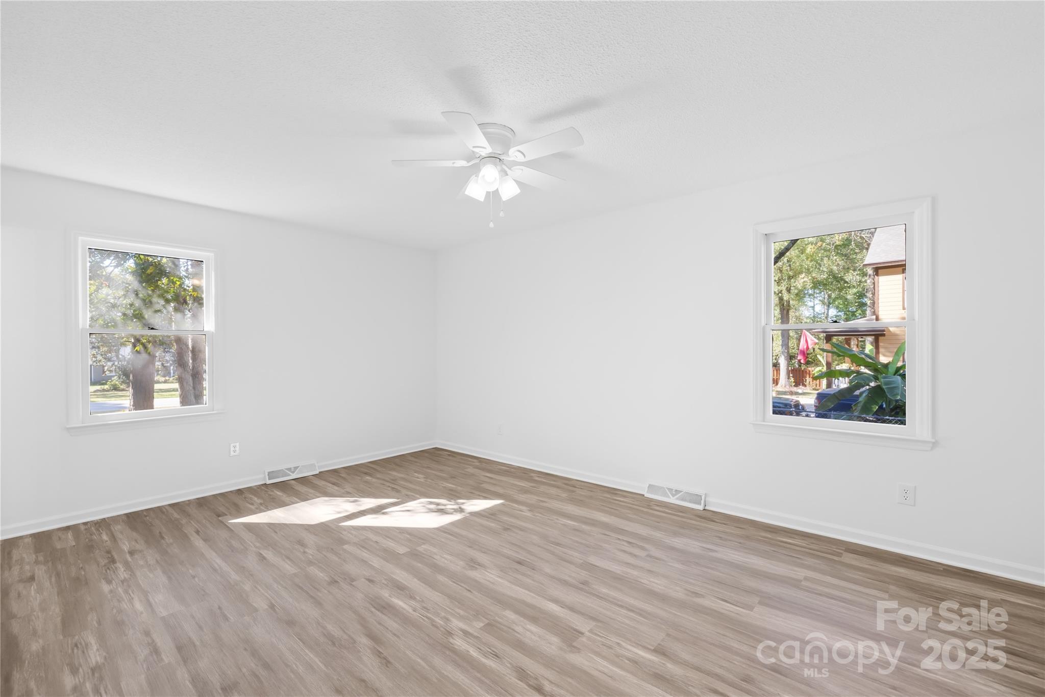 700 Chestnut Lane Matthews, NC 28104 - Photo 20 of 39 a view of empty room with window and ceiling fan