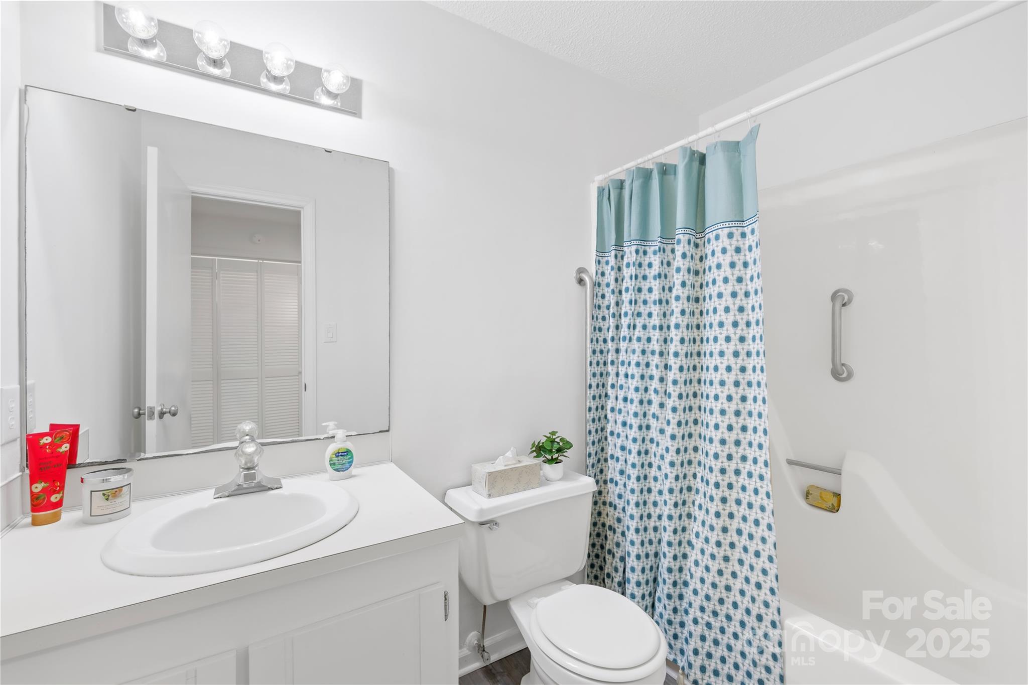 700 Chestnut Lane Matthews, NC 28104 - Photo 25 of 39 a bathroom with a sink a toilet and shower