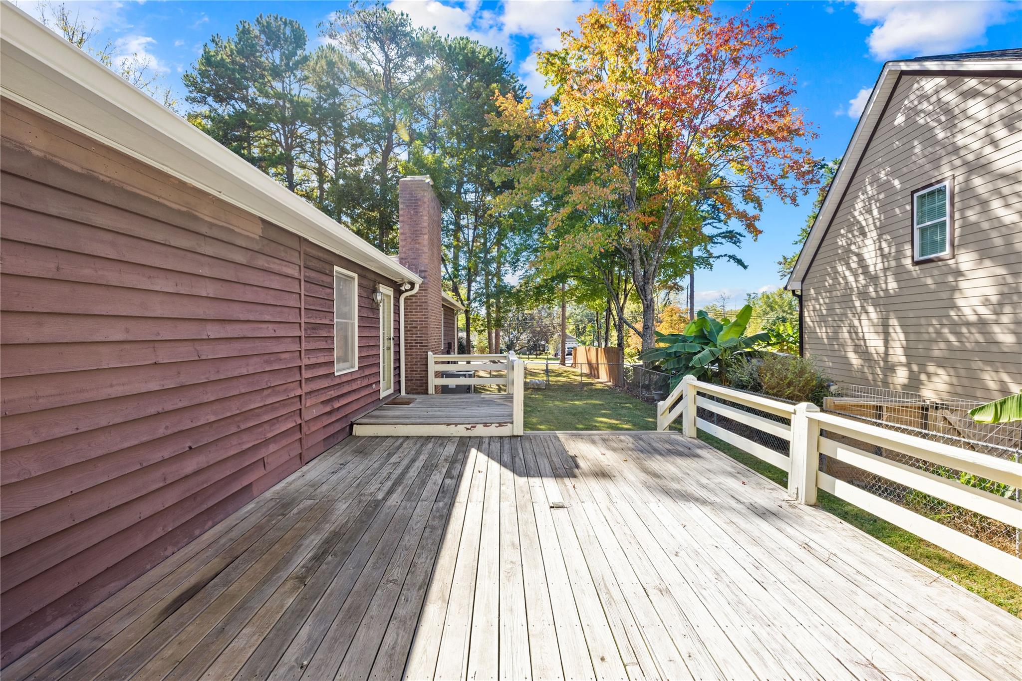 700 Chestnut Lane Matthews, NC 28104 - Photo 31 of 39 a view of outdoor space with wooden floor and trees in the background