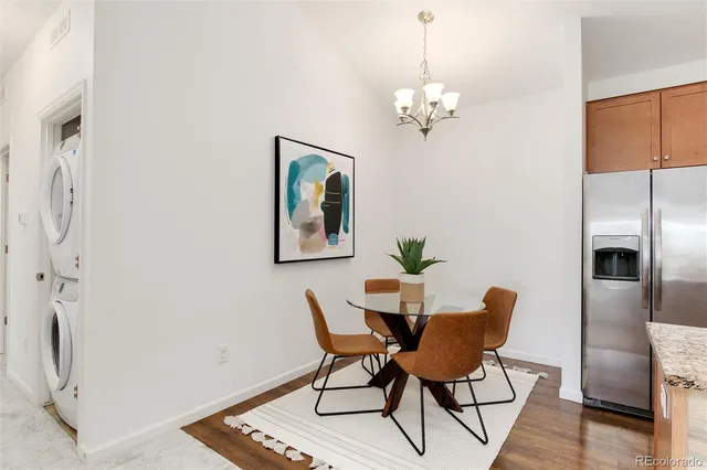 a dining room with furniture and chandelier