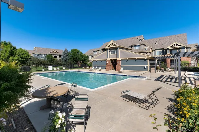 an outdoor space with furniture and umbrella