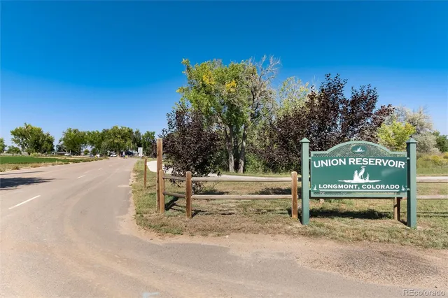 a view of a park with iron fence
