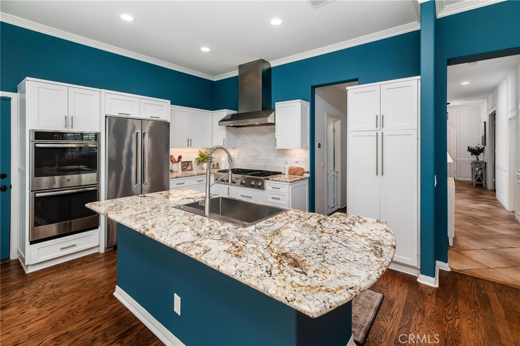 789 Glenhart Place Fallbrook, CA 92028 - Photo 14 of 40 a kitchen with stainless steel appliances granite countertop a refrigerator and a stove top oven