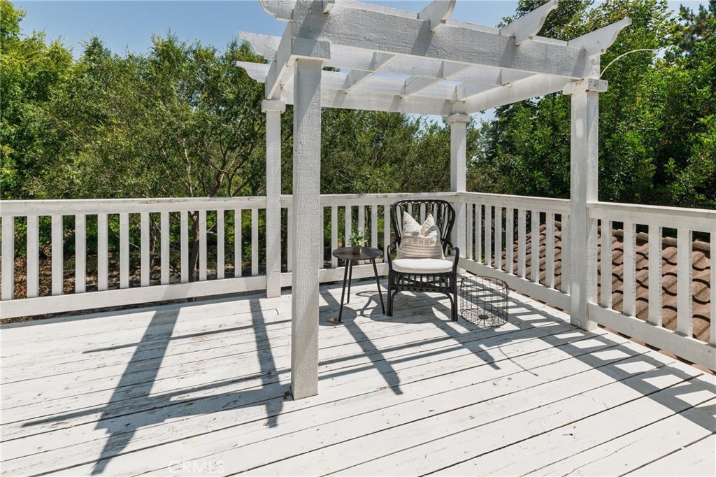789 Glenhart Place Fallbrook, CA 92028 - Photo 17 of 40 a view of balcony with wooden floor and outdoor seating