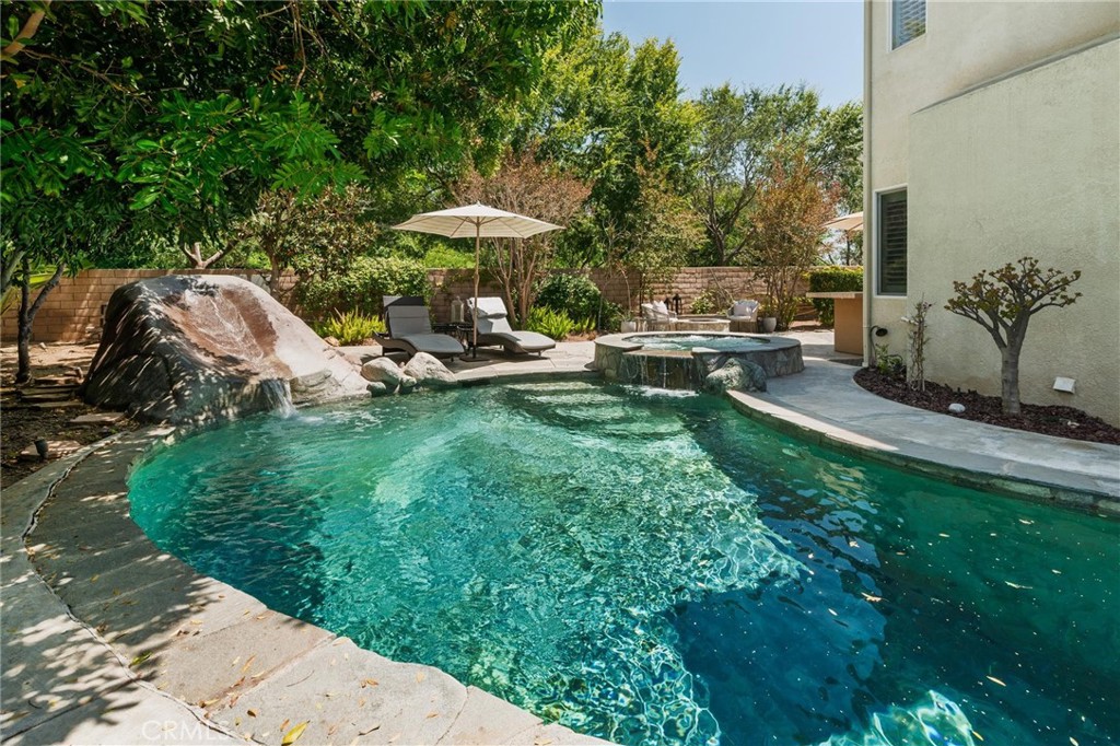 789 Glenhart Place Fallbrook, CA 92028 - Photo 19 of 40 a view of a table and chairs in backyard