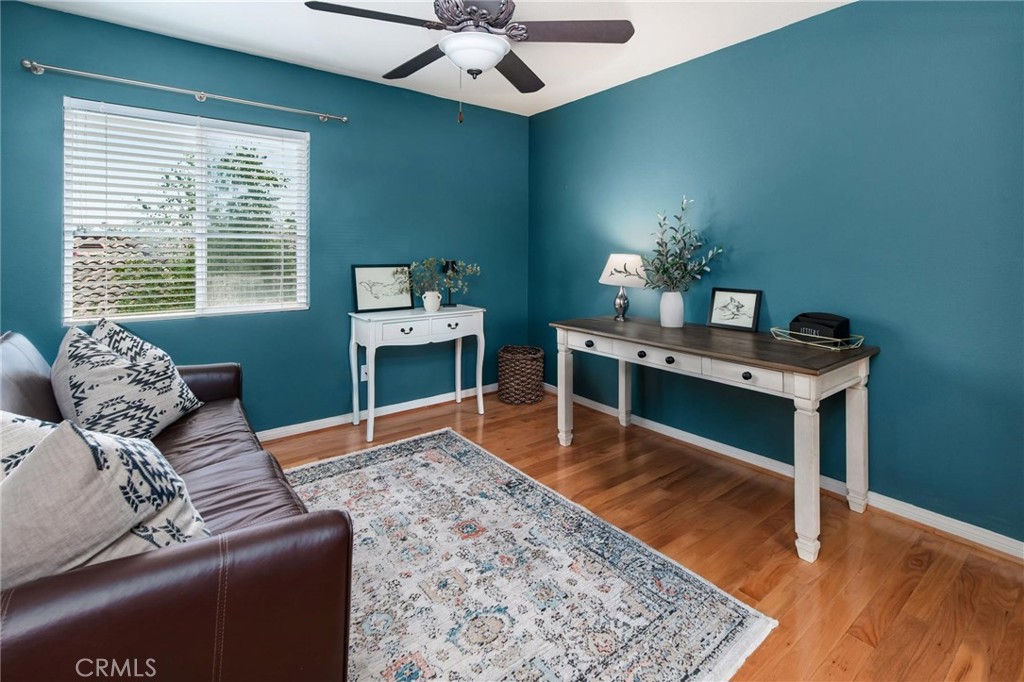 789 Glenhart Place Fallbrook, CA 92028 - Photo 25 of 40 a living room with furniture and wooden floor