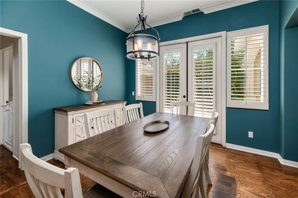 789 Glenhart Place Fallbrook, CA 92028 - Photo 8 of 40 a view of a dining room with furniture window and wooden floor