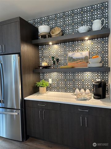 a kitchen with a sink and wooden cabinets