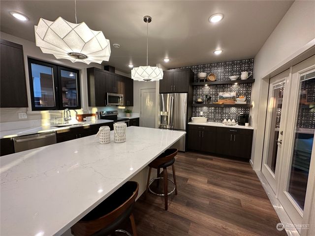 a kitchen with a table and chairs in it
