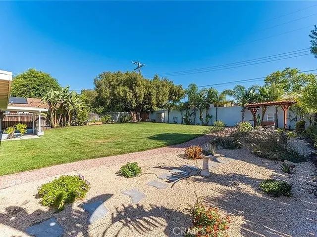 a view of a chair and tables in the garden