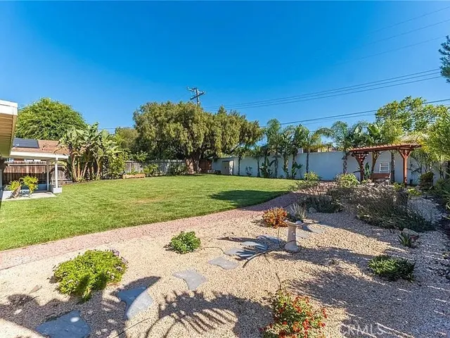 a view of a chair and tables in the garden