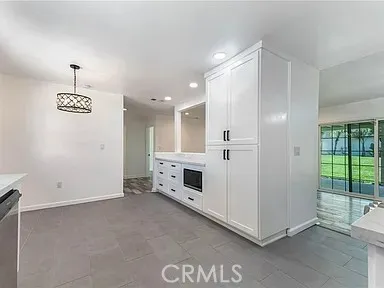 a view of a livingroom with furniture and chandelier