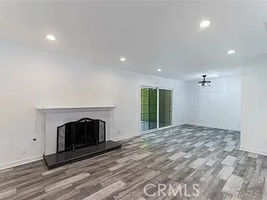 a living room with a fireplace and a fireplace