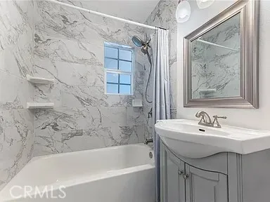 a bathroom with a sink and a bathtub