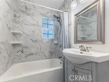 a bathroom with a sink and a bathtub
