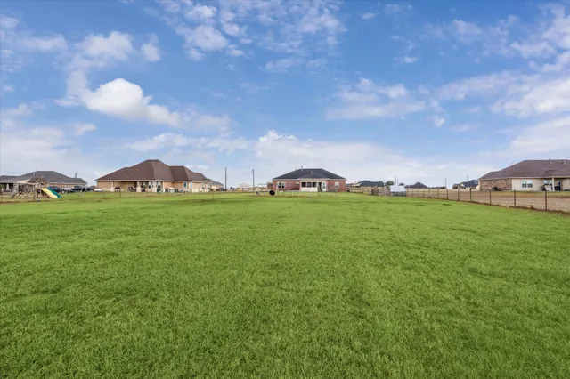 a view of yard with outdoor seating and green space