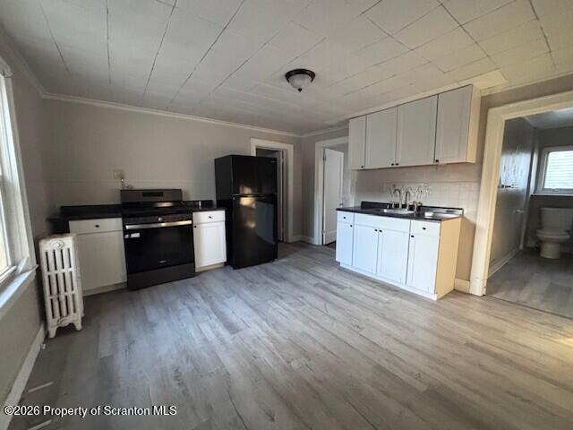 130 Willow Street Dunmore, PA 18512 - Photo 6 of 7 a kitchen with granite countertop a stove top oven and cabinets