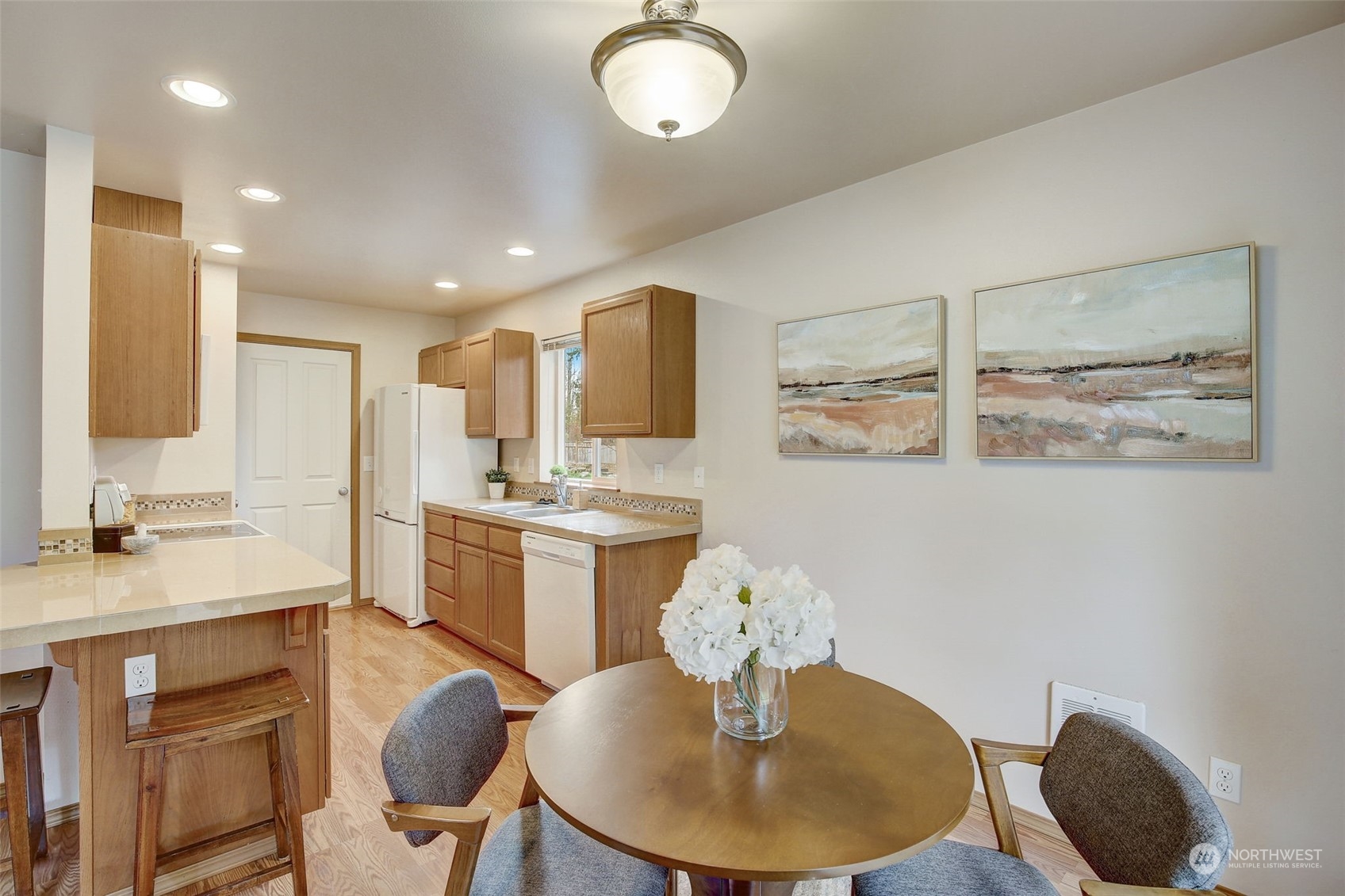 13413 Meadow Road Everett, WA 98208 - Photo 11 of 27 a kitchen with kitchen island stainless steel appliances a sink and cabinets