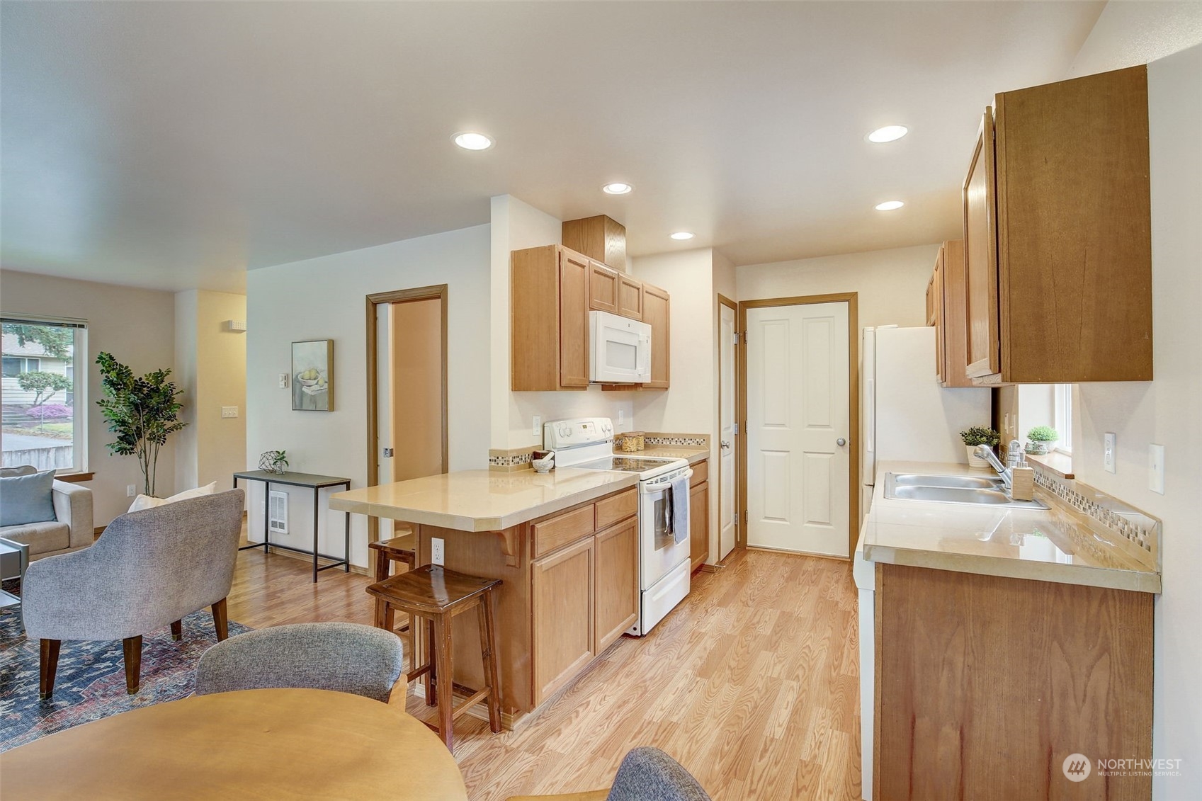 13413 Meadow Road Everett, WA 98208 - Photo 12 of 27 a kitchen with a sink stove and refrigerator