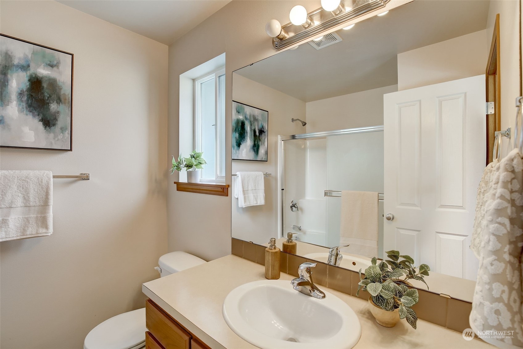 13413 Meadow Road Everett, WA 98208 - Photo 17 of 27 a bathroom with a sink mirror and toilet