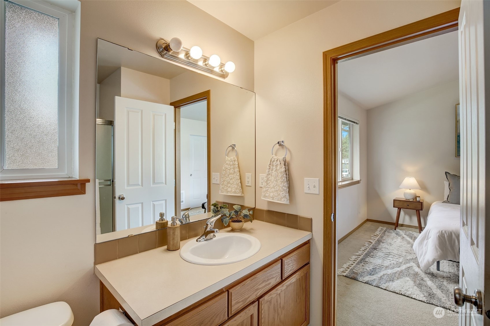 13413 Meadow Road Everett, WA 98208 - Photo 18 of 27 a en suite bathroom with a sink and a mirror