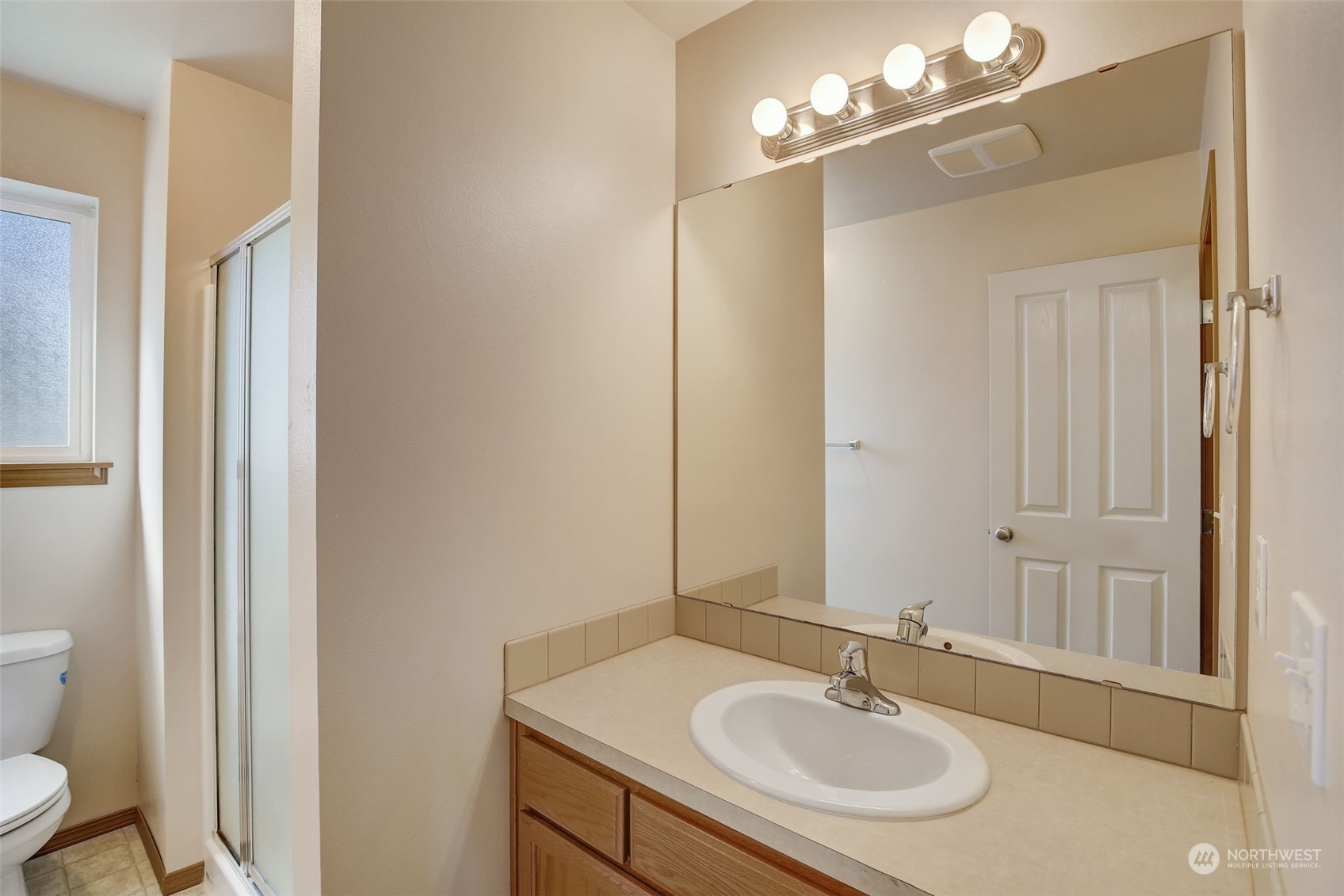 13413 Meadow Road Everett, WA 98208 - Photo 19 of 27 a bathroom with a sink and a mirror